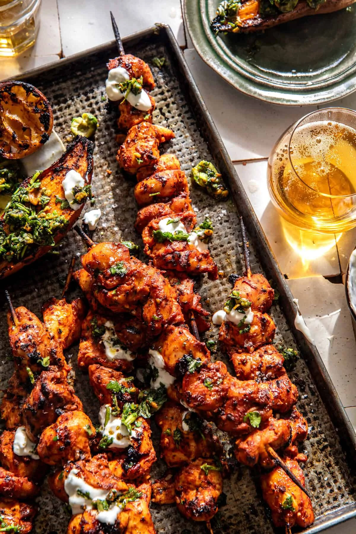 Sheet Pan Lemon Garlic Chicken with Sweet Potatoes and Feta Yogurt Sauce Offers a Flavorful and Convenient Meal Option